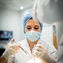 الدكتورة العلمي وفاء طبيب أسنان